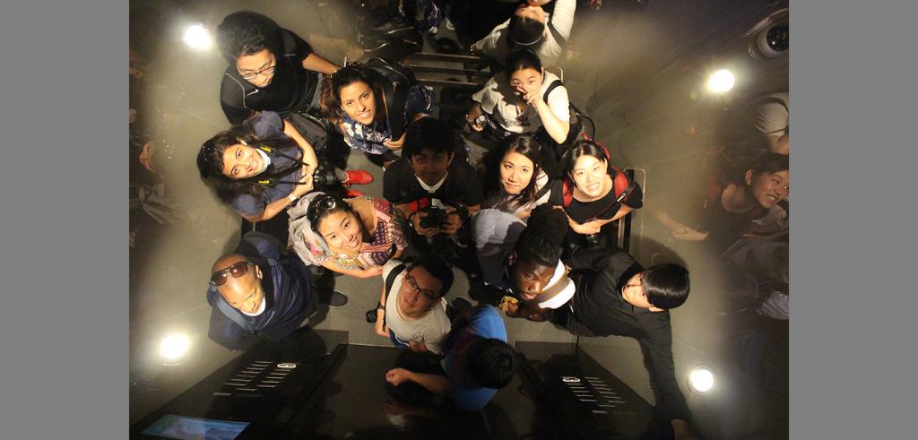 overhead view of people standing in an elevator