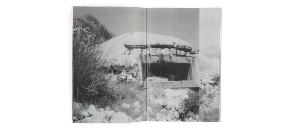 spread of a book with a black and white image of a bunker