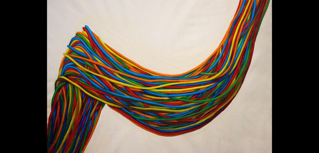 Bright colored strings in blue, green, yellow, red and orange colors, strung together in a cascading wave.