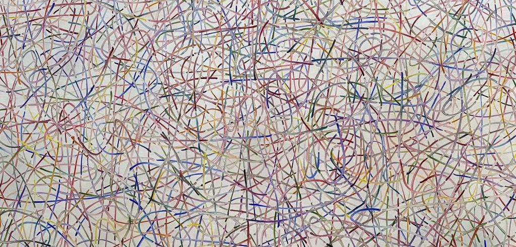 Red, blue, green, and yellow lines intersecting.