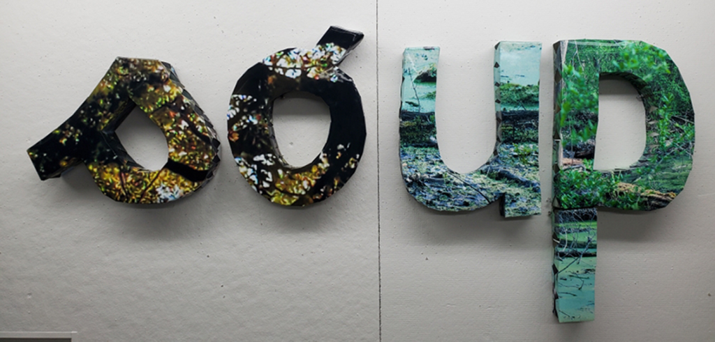 A photograph of three-dimensional lowercase letters spelling out 