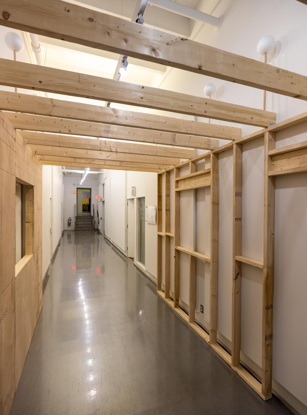 A hallway with wooden beams installed