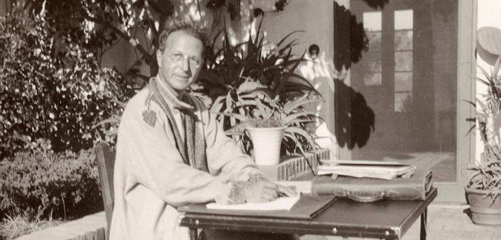 man at a desk seated outside