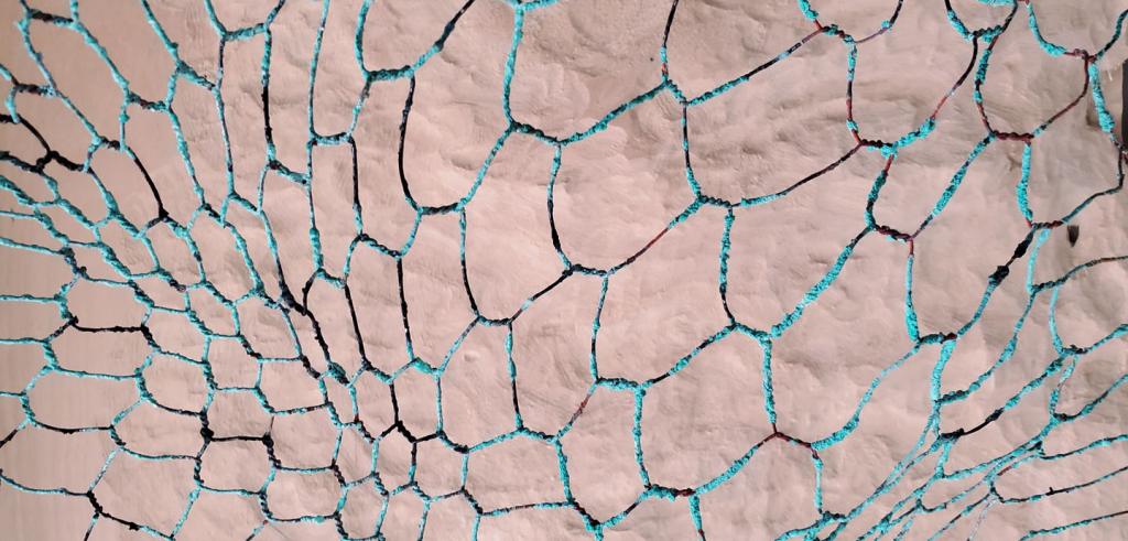 Cream textured background with seafoam green honeycomb grid pattern beneath it.
