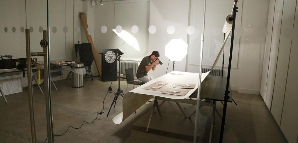 student in a photo studio taking pictures