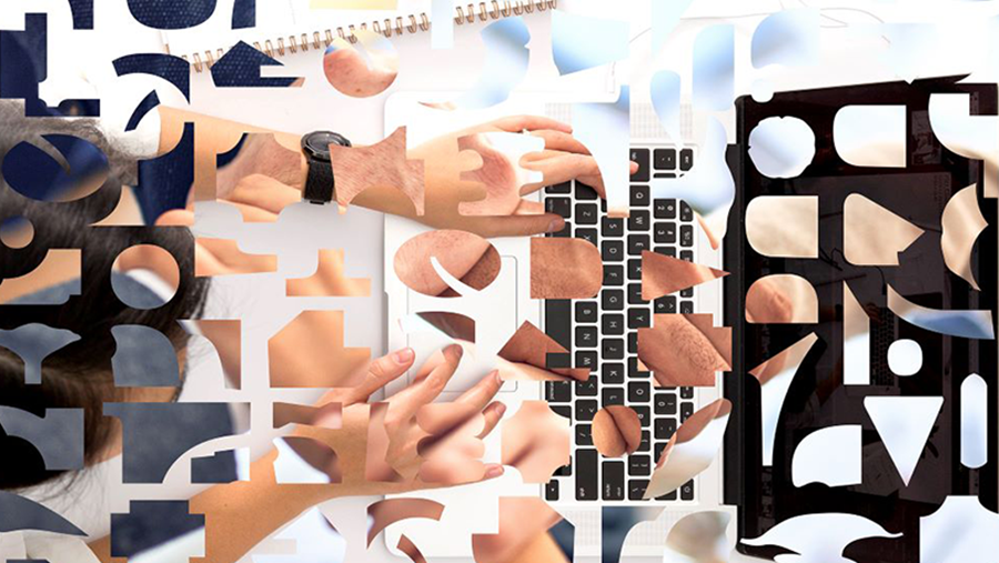 Overhead view of person typing on a laptop superimposed with geographic shapes