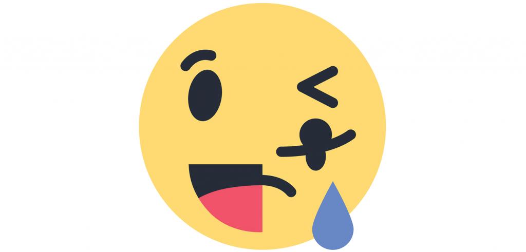 Yellow smiley emoji with half face smiling the other half with a crying face.