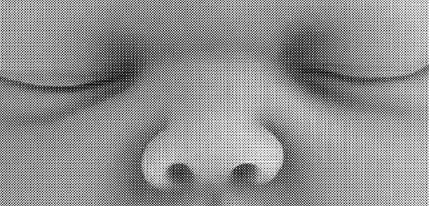 Black and white image of a young child's eyes and nose.