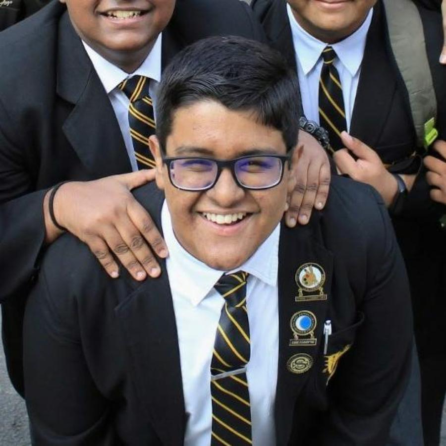 Boy in suit with black glasses