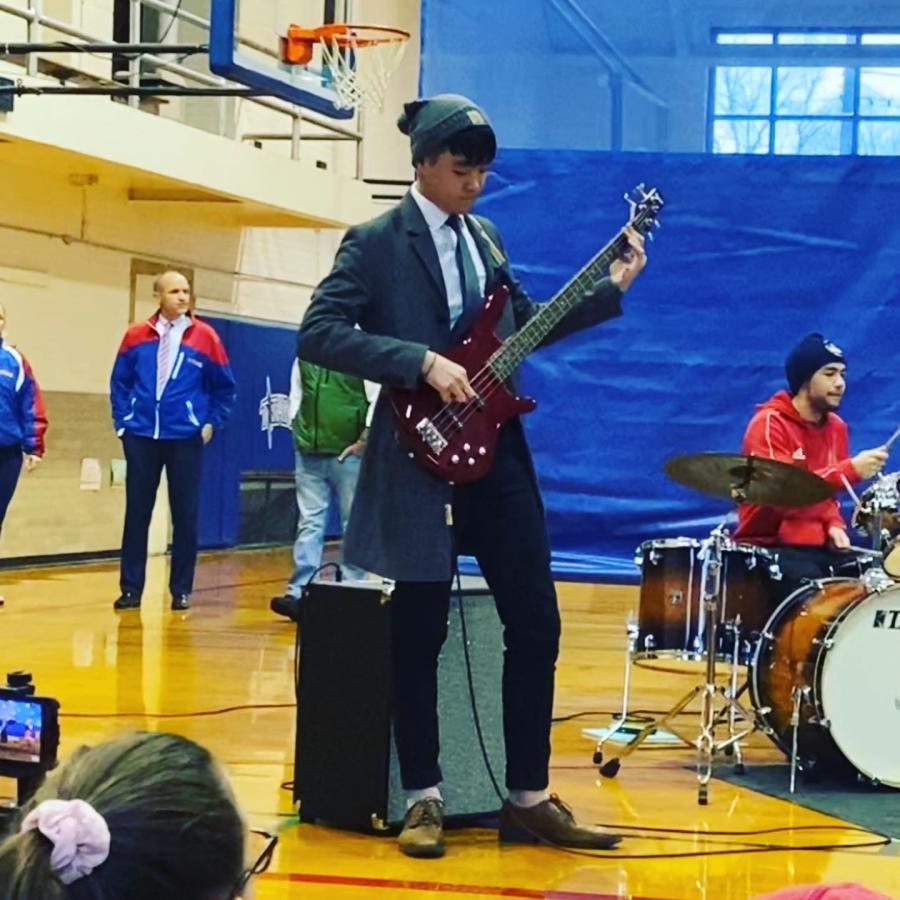 man standing with guitar 