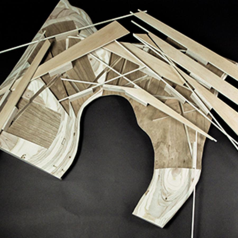 Photograph of model made of milled wood with slots cut into it and thin plywood and basswood set into the slots.