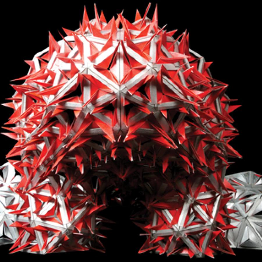 model of structure that is round and covered with red spikes