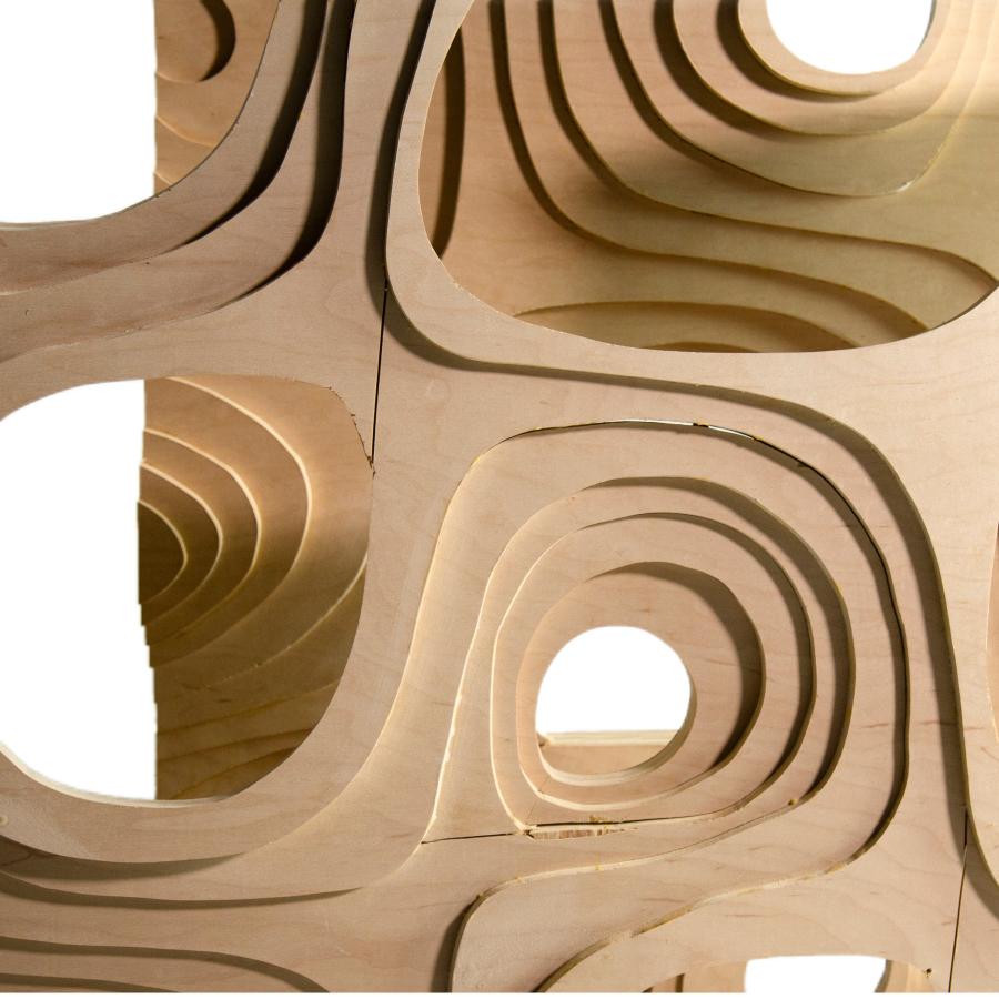 Wood screen with circular openings.