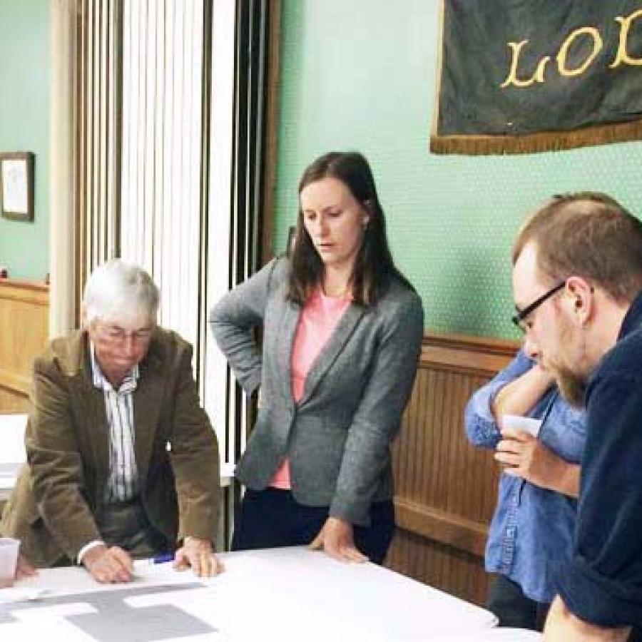 Lodi community members and Design Connect students look at plans for the library