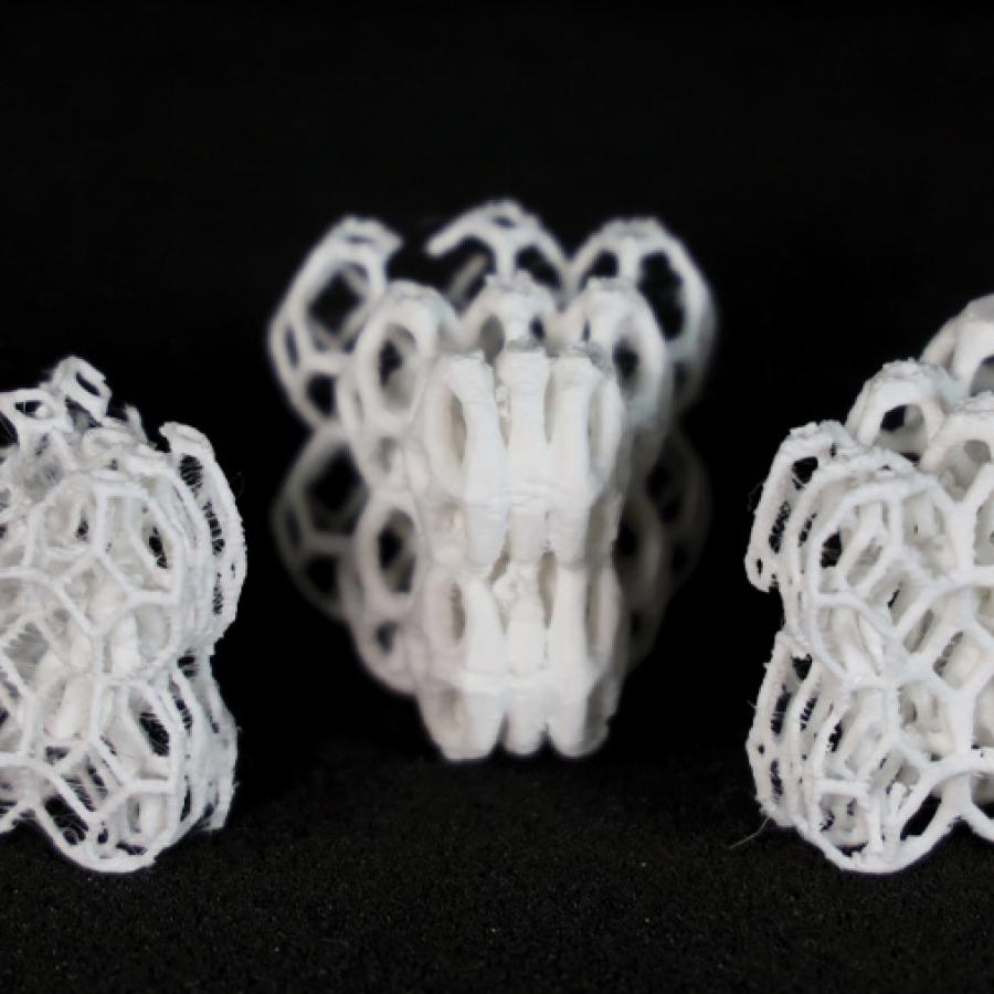Three 3D-prints of a porous brick-like structure, each with different levels of thickness.