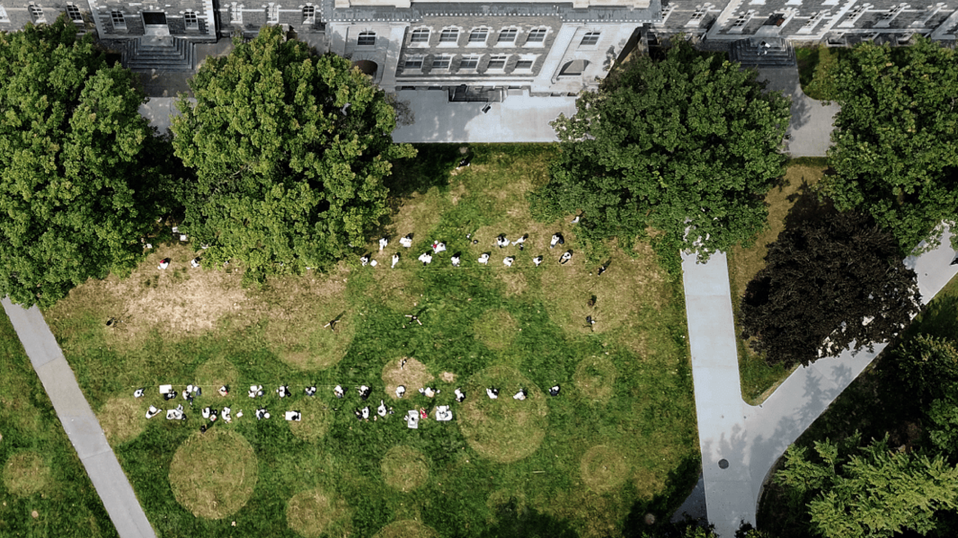 A grassy area with a building as seen from above.