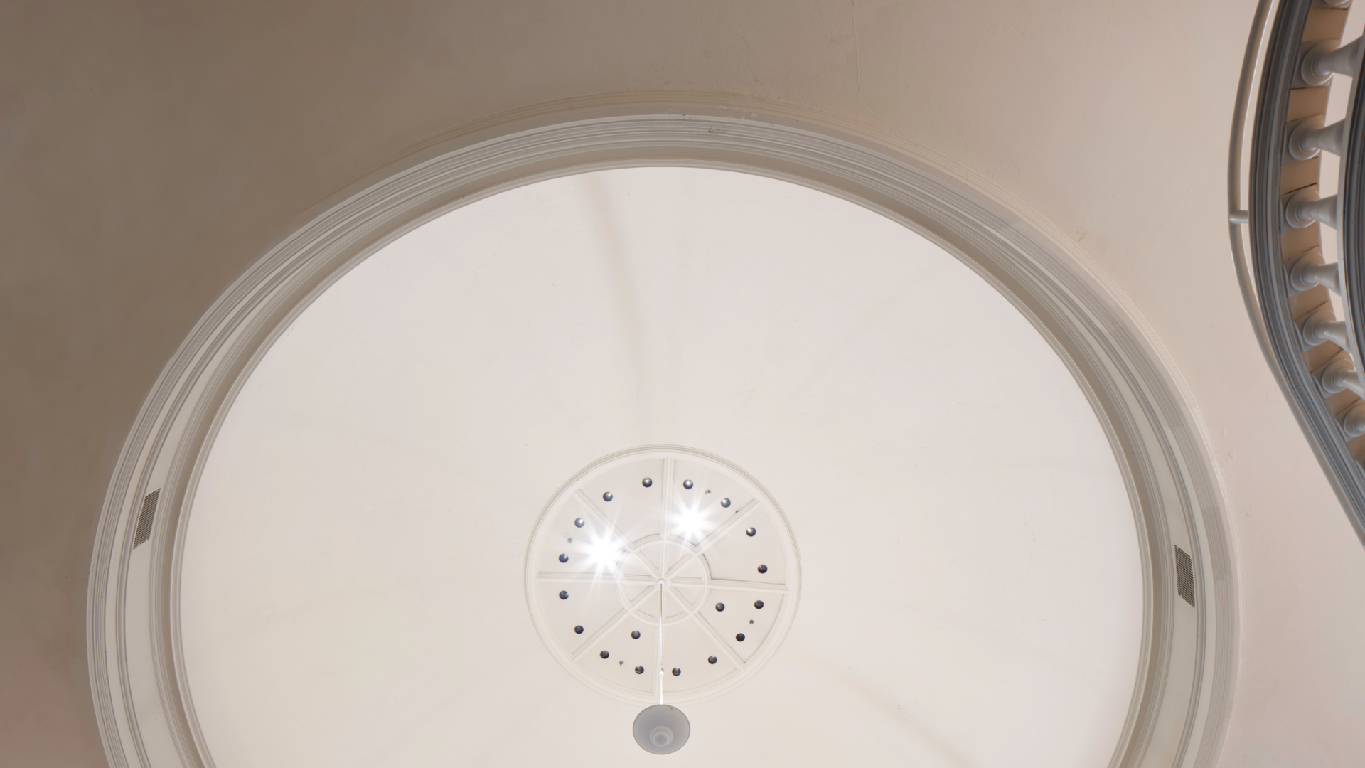 a domed ceiling with circular lights