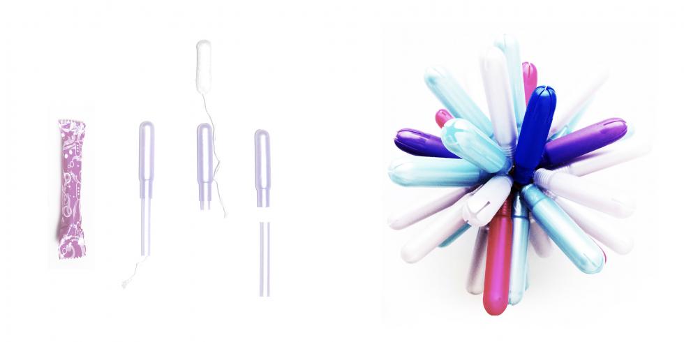 Tampon applicators next to a spherical structure. 