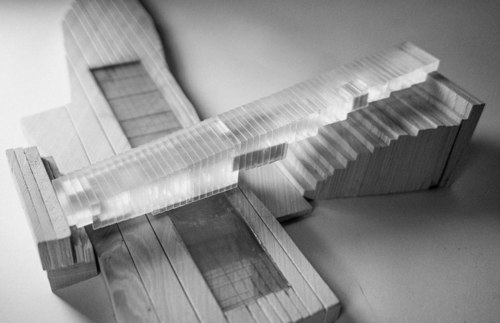 An architectural model constructed from wood and plexiglass. 