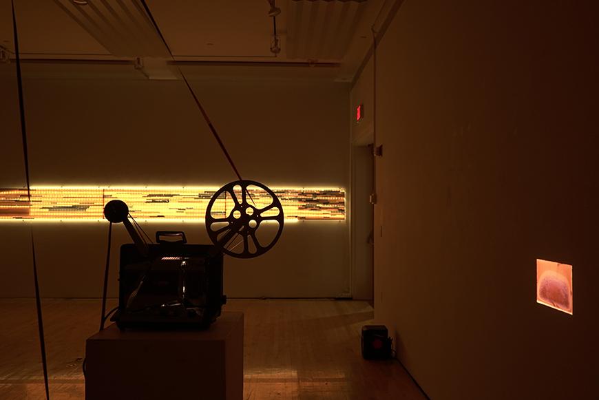 Image of projector with two projections on the walls.