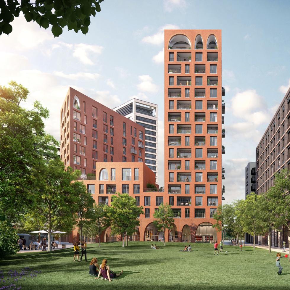 Orange buildings of varying heights seen in a green courtyard