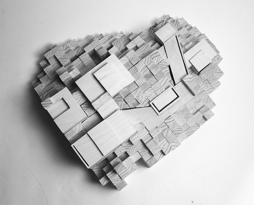 Grayscale photograph of model with site amassed from square wooden blocks or dowels, with spaces built from basswood set into the representation of the topology.