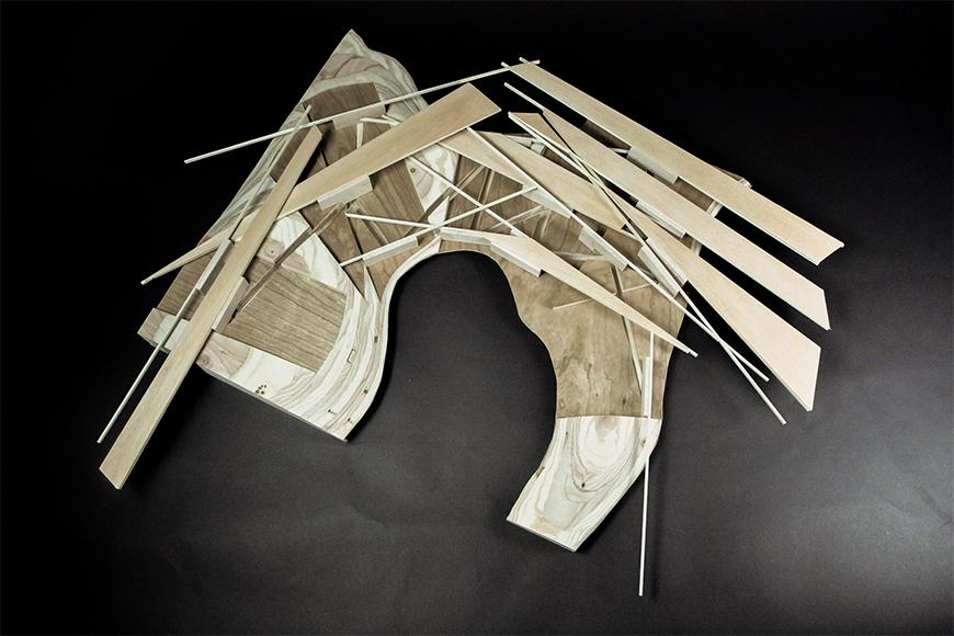 Photograph of model made of milled wood with slots cut into it and thin plywood and basswood set into the slots.