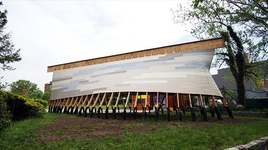 wooden structure shaped like a slightly curved ark