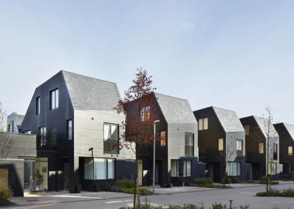 Five identical grey buildings in a row