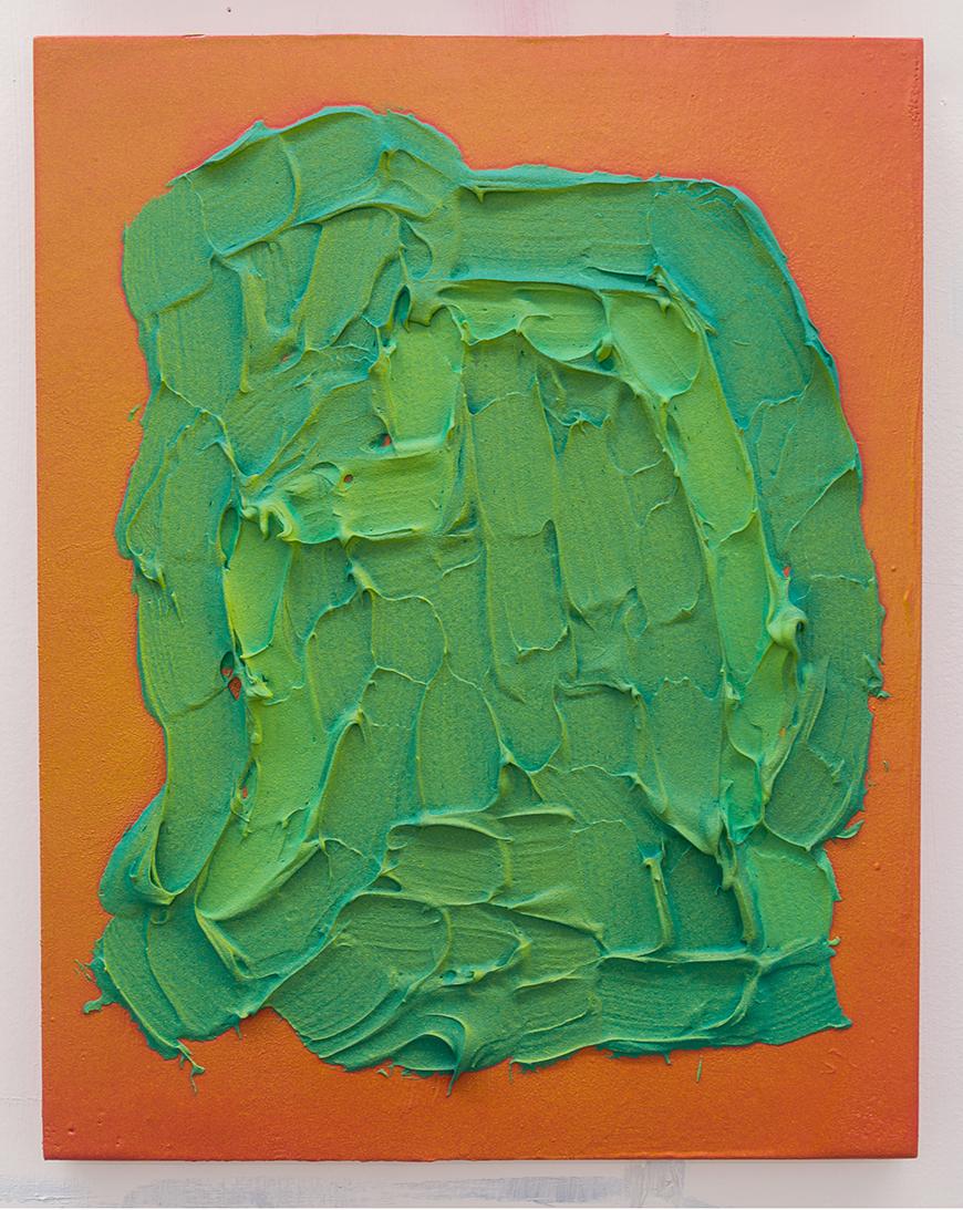 Color photo of a canvas with 2d orange background covered in 3d textured green paint in an abstract shape. 
