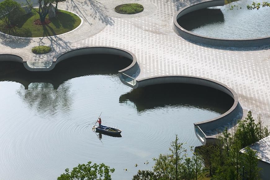 pedestrian bridge with circular cutouts at the edges