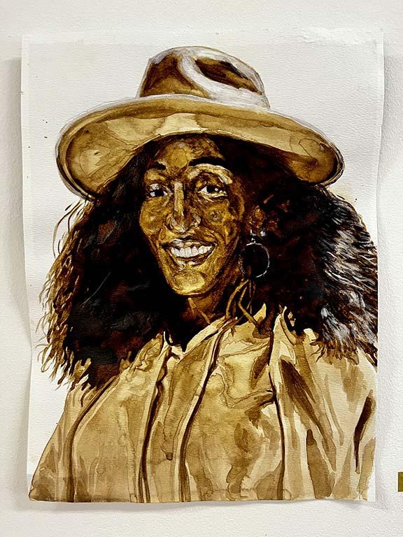 Brown water color painting of a woman with thick brown hair, smiling, wearing a fedora hat.