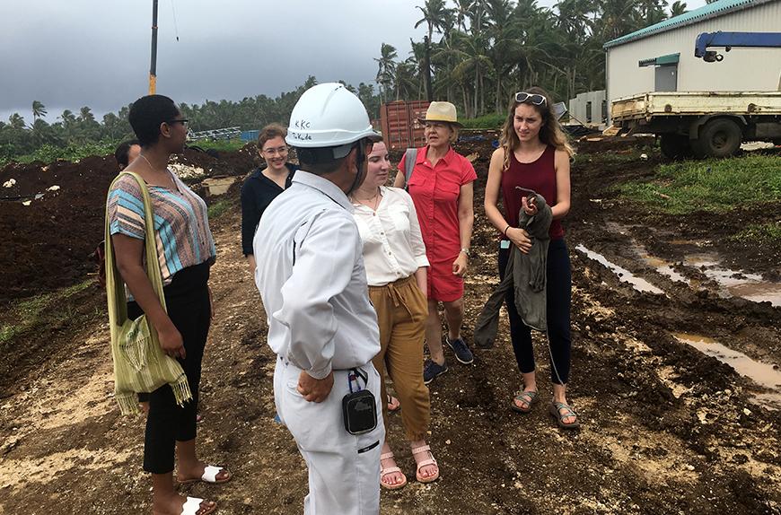 group of people standing at construction site