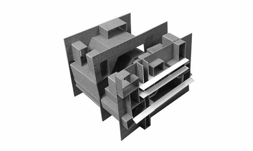 Model made out of chipboard and paper showing three different sections with smaller rooms within.