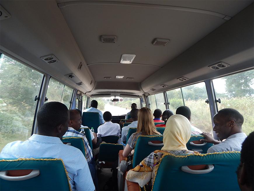 People seated inside a bus.