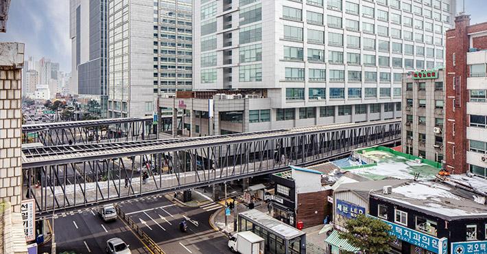 Walkway over a dense urban street