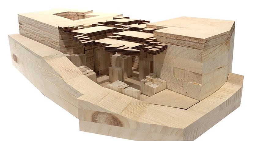 An architectural model constructed from wood. 