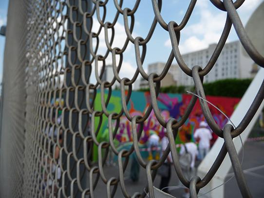 ball court seen through chain link fence