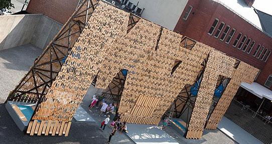 a large wall sculpture that spells Wall upside down