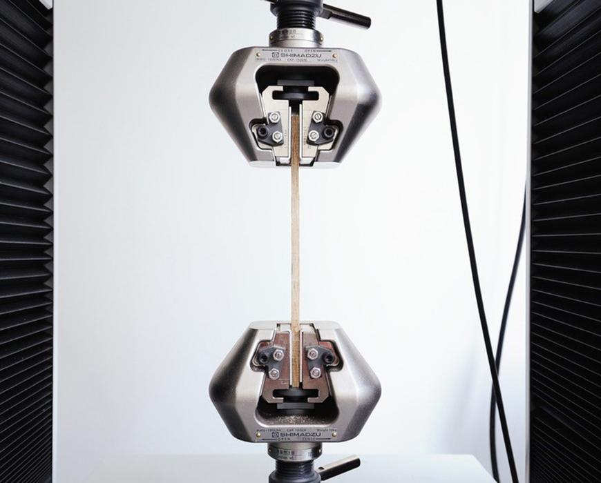 Two mechanical objects joined vertically by a rod