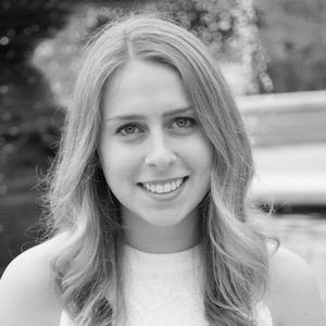 black and white headshot of a woman with long light brown hair