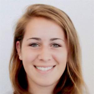 headshot of a young woman with light brown hair