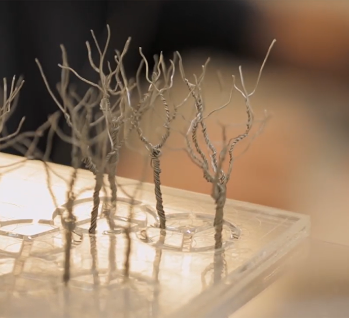 Metal trees as part of an architectural model.