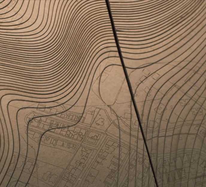 A series of contour lines on a brown wooden flat surface.
