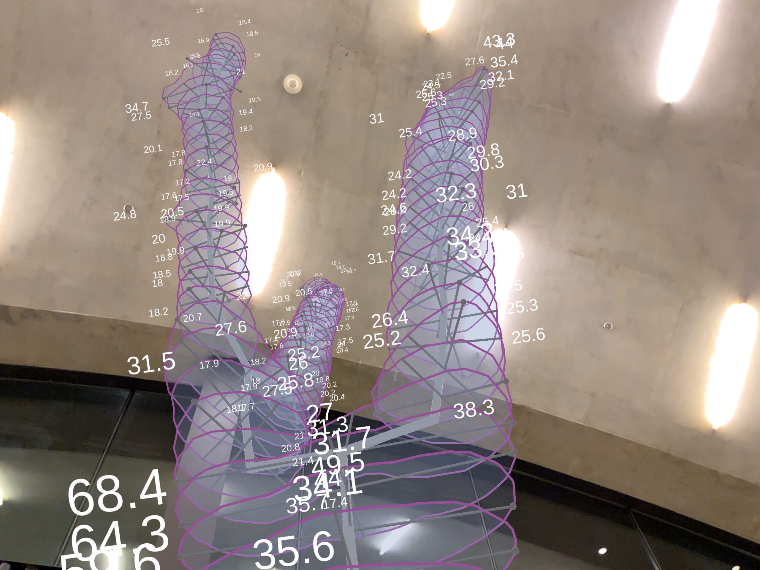 Mixed reality visualization for an irregularly shaped timber structure, superimposed in front of a concrete wall.