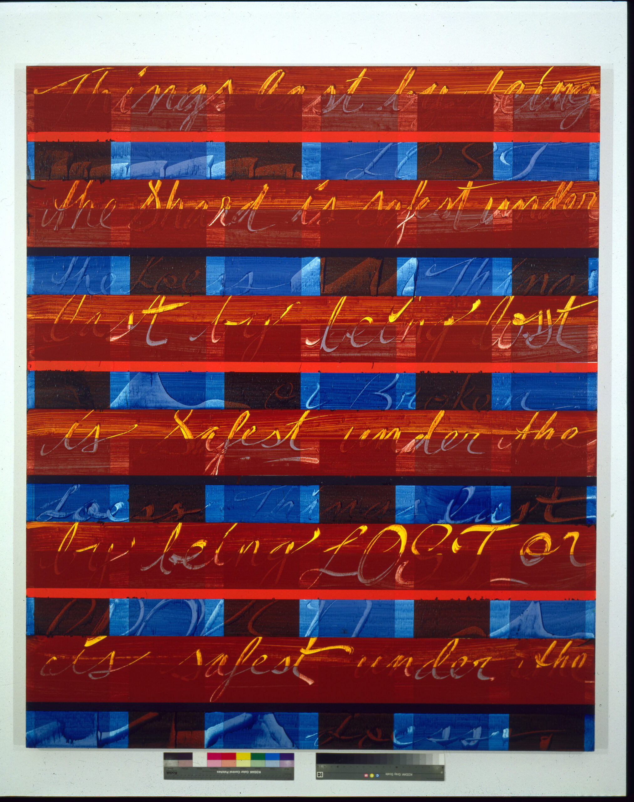 red and blue color block painting with words in yellow