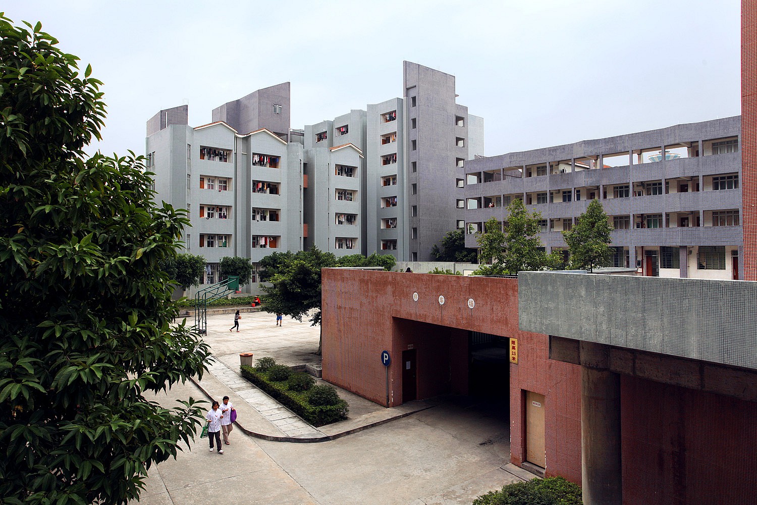 Entry to a parking garage near apartment buildings.
