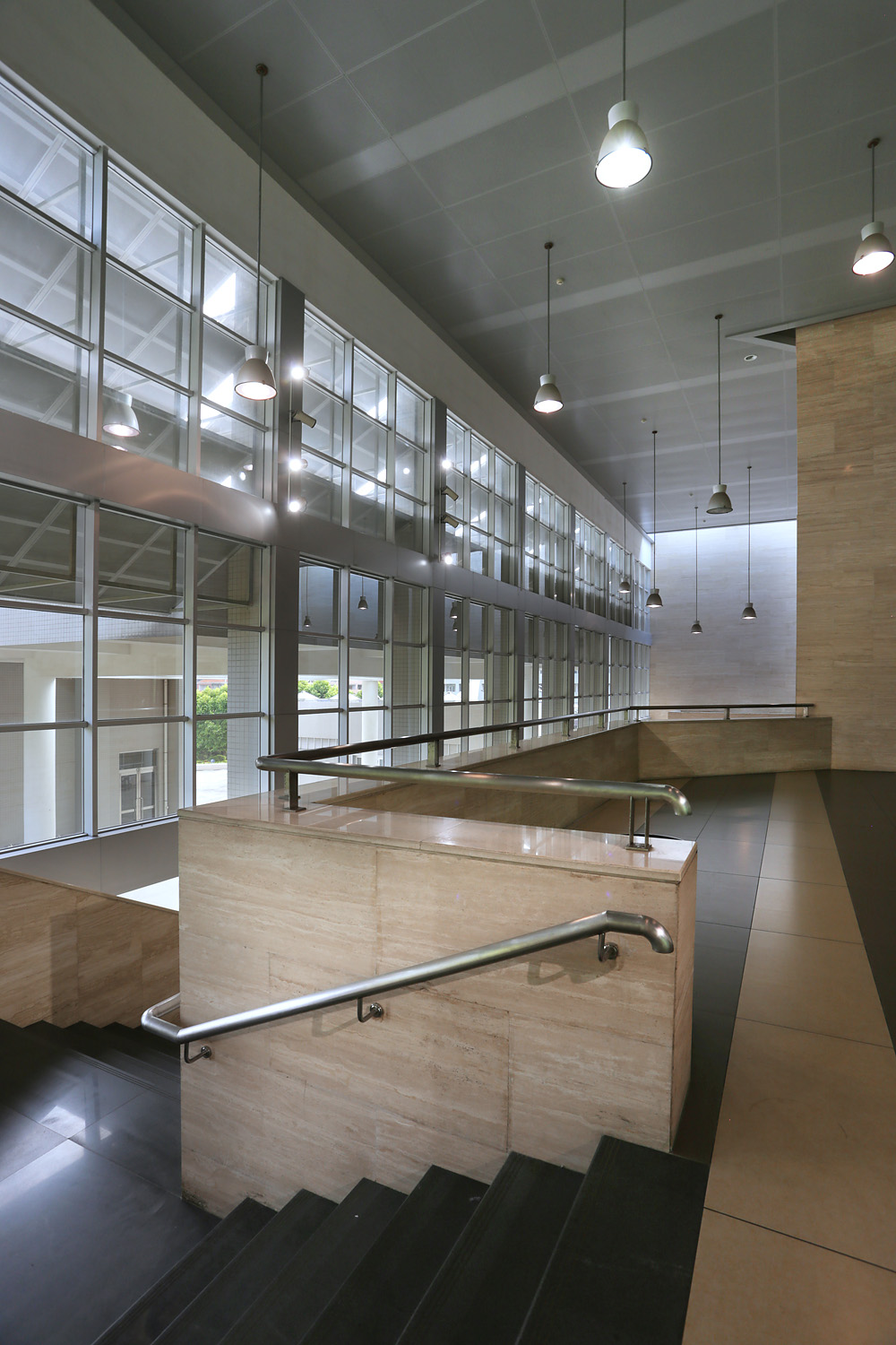 View of lobby stairwell and a wall of windows