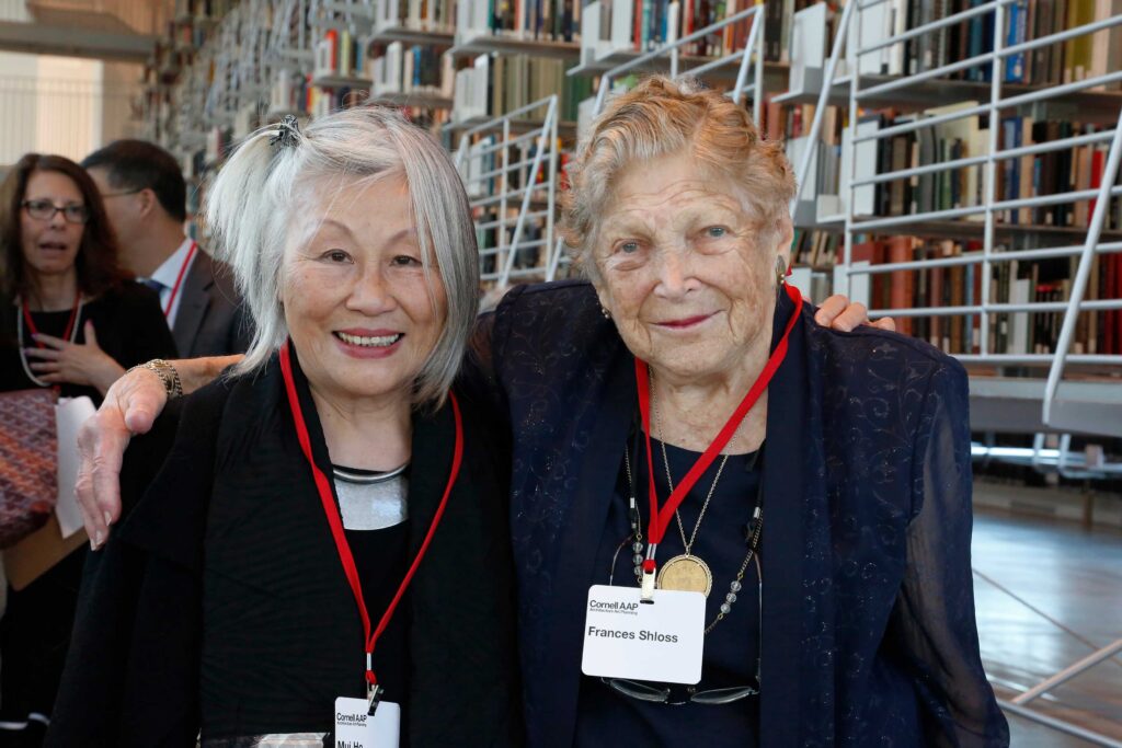 Two older women pose for the camera