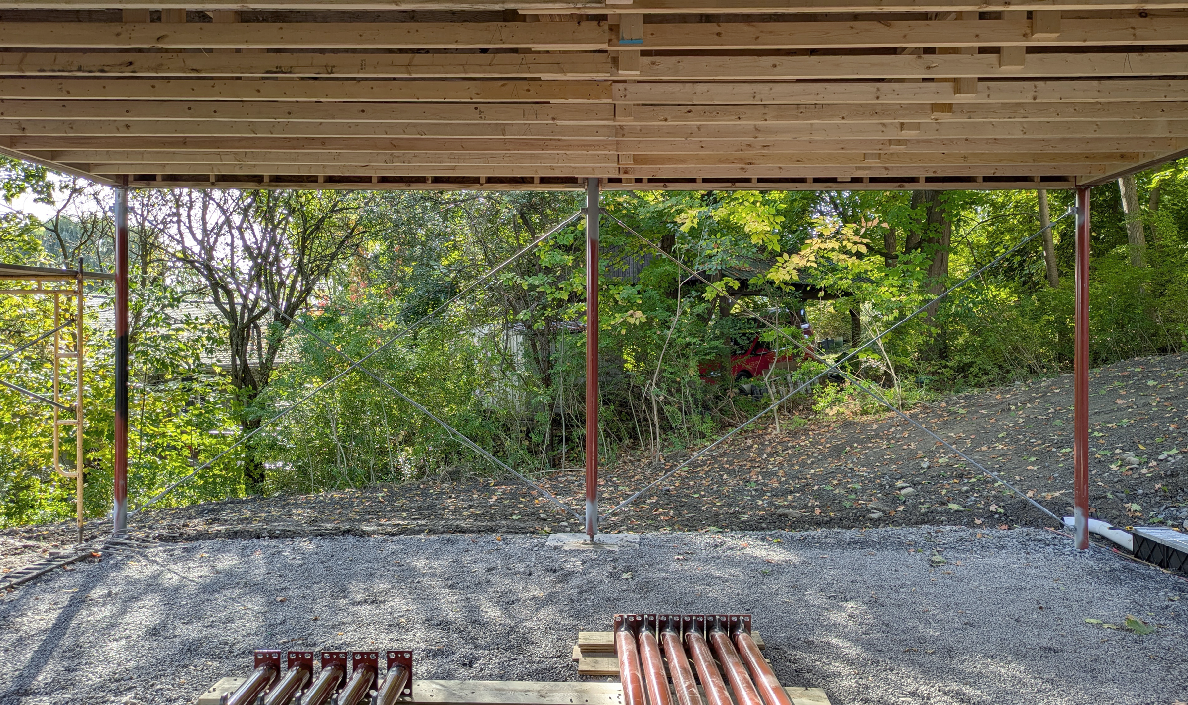 gravel pad covered by wooden roof